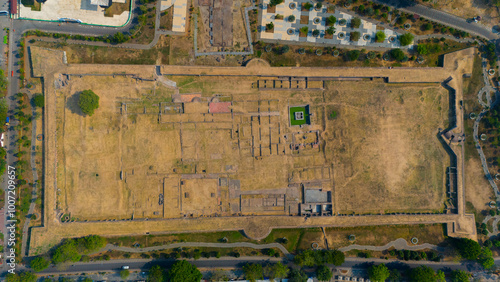 Aerial snapshot of a historical site, showcasing remnants of ancient architecture enclosed within formidable walls