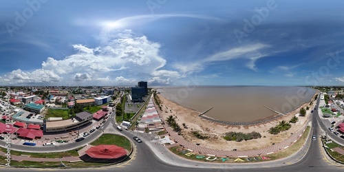 360 aerial photo taken with drone of Kingston Seawall Esplanade and Seawall bandstand on sunny afternoon in Georgetown, Guyana