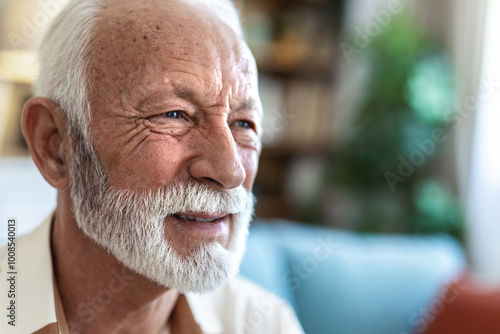 Thinking, memory and old man with nostalgia, lounge and nursing home on sofa to relax in lonely retirement. History, remember and vision of past life memories, elderly person and couch in apartment.