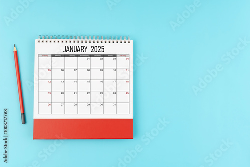 January desk calendar for 2025 year with pencil on blue background, Position with copy space.