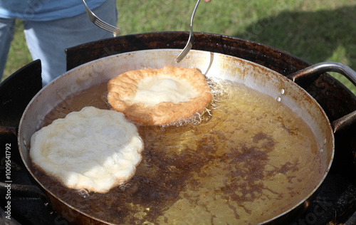 two fritters that are cooked in boiling oil during the village festival