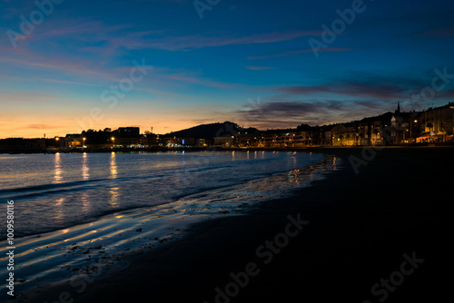 Image of Panxon beach and its promenade at dusk with a beautiful blue sky with clouds. Nigran - Galicia - Spain