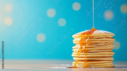 Fluffy American pancakes, tall stack drizzled with maple syrup