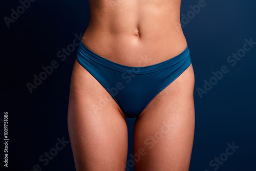 No filter cropped photo of lady belly underwear lingerie perfect skin isolated blue color background