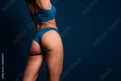 No filter cropped photo of lady ass underwear lingerie accepting imperfect skin empty space isolated blue color background