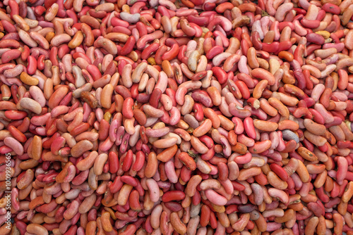 Abstract shapes, patterns and textures of piles of red bean seeds. Red bean seeds for making plants or for seeds. For graphic or banner design