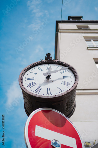 Classic Clock with Roman Numbers Standing in the City in the Afternoon