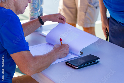 Players stand in line to register at pickleball tournament