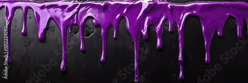 liquid purple paint dripping on black wall 