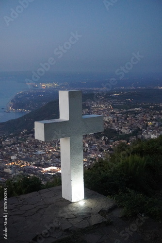 White cross on a hill with panoramic sea view. Panoramic view of the hill. Top of the Three Crosses mountain on Mount Sant'Elia Italy 10/06/2024