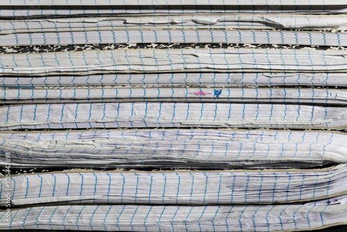 Close-up of Worn Notebooks Spines. Close-up shot of the spines of worn notebooks, emphasizing the aging and texture of their pages. Perfect for themes related to study, writing, and creativity.