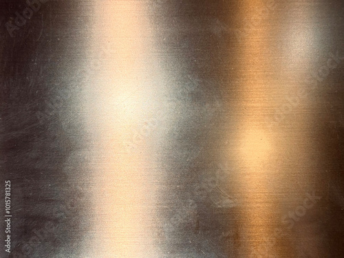 Gold metallic stainless steel sheet in hairline brushed pattern with shades of lights and reflection effects. Stainless steel contour and effects, gold copper and brass color.