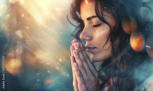 Woman praying on beautiful glowing background, religious concept