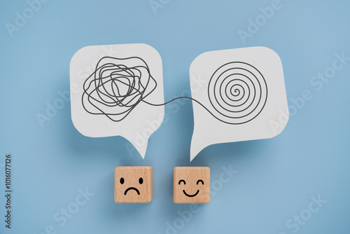 Mental health, brain disorder, World mental health day, Alzheimer, Psychology concept. Tangle of thoughts and clear line on real white speech bubbles paper cut and emoticon face on cube blocks