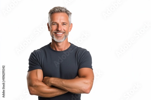 Happy middle aged man isolated on white studio background. Confident mature mid adult handsome male model wearing t-shirt looking at camera with arms crossed.