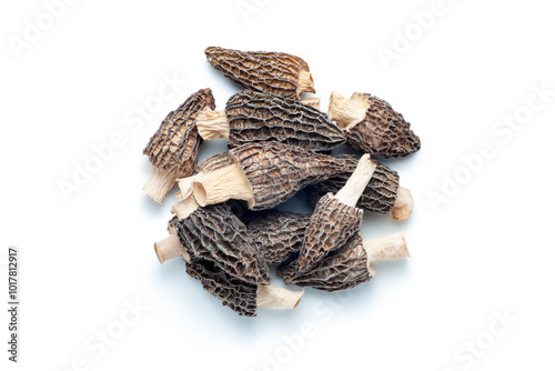 Pile of dried morel mushrooms isolated on white background, Top view