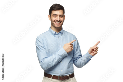 Happy smiling young businessman pointing away