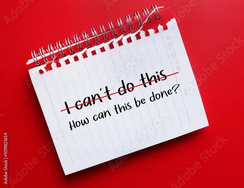 Notebook on red background with handwriting I CAN'T DO THIS, changed to HOW CAN THIS BE DONE? - to replace negative self talk with positive affirmation, overcome self doubt and boost self esteem and