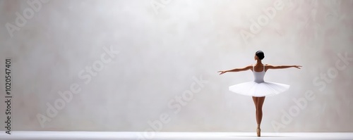 Ballet dancer performing a pirouette, showcasing grace and balance on a lit stage, dance, ballet pirouette