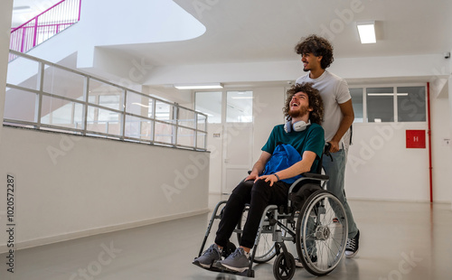 A happy diverse students in university hallway, a classmate pushing a friend in a wheelchair as they walk down the school corridor or male patient smiling with friendly caregiver in hospital corridor.