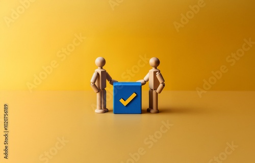 Two wooden figures stand on a yellow background with a blue block containing a checkmark.