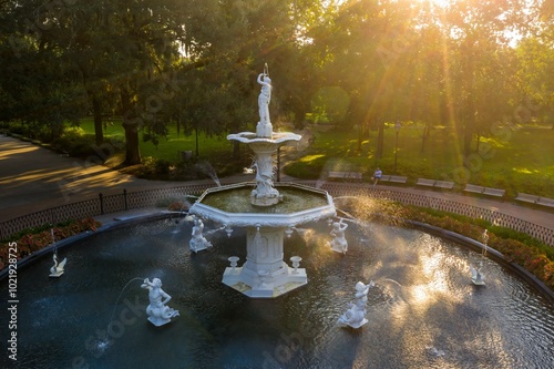 Oak trees and Fountain at Forsyth Park at sunrise. Savannah, Georgia, United States.