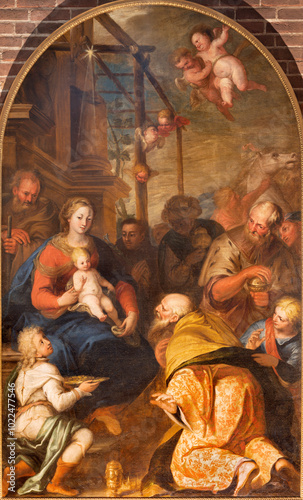 PAVIA, ITALY - SEPTEMBER 9, 2024: The painting of Adoration of Magi in the church Chiesa di San Teodoro by Calro Sacchi (1616 - 1707).