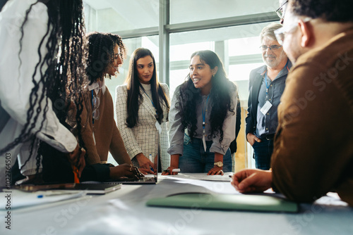 Diverse team brainstorming during a business meeting in a modern office