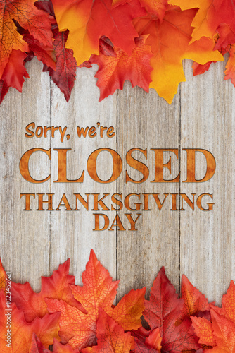 Sorry we are closed Thanksgiving Day with fall leaves on weathered wood