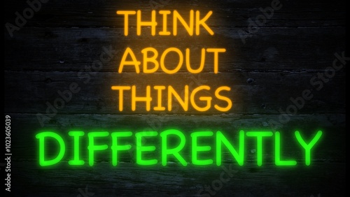 think about things differently neon effect sign on a dark background