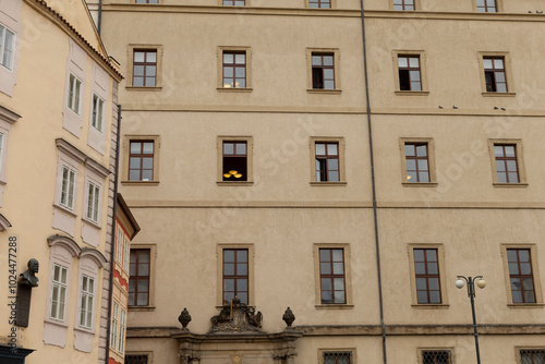 A remarkably large building featuring a striking yellow moustache artfully displayed in the window, catching everyones attention