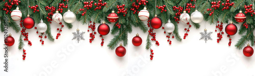 christmas festive holiday decoration with a border of pine branches, red berries, and various Christmas ornaments in red, white, and silver hues. The decorations hang from the top, l