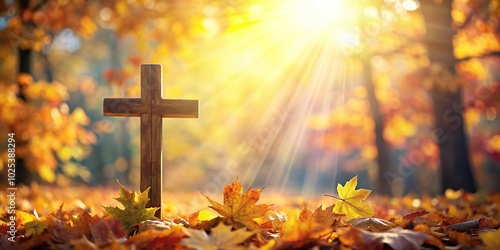 Christian cross with sunlight on autumn leaves background