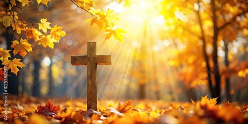 Christian cross with sunlight streaming through fall autumn leaves, creating a peaceful and serene background