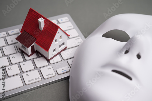 House, keyboard computer, white mask scammer on gray background. Real estate, property, land, rental, mortgage closing scams concept. Protect money from real estate scams when buying, rental a home.