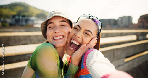 City, selfie and excited women hug, smile and laugh with cool streetwear on bridge together. Social media, support and happy gen z friends with urban fashion, post and fun bonding in street portrait.