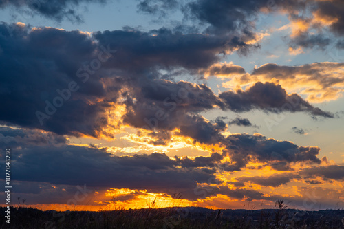 dramatic sunset, with soft clouds and warm hues