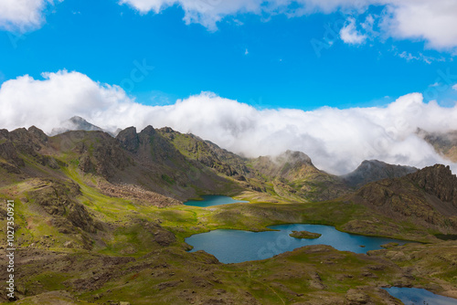 Lakes and fog covered mountains on the background. Nature background photo