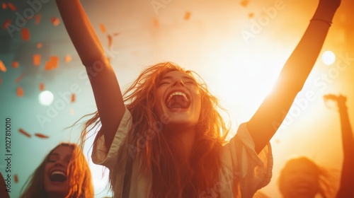 A joyous woman wearing a white shirt celebrates with open arms as confetti falls around her, bathed in a vibrant and warm glow during an exciting event atmosphere.