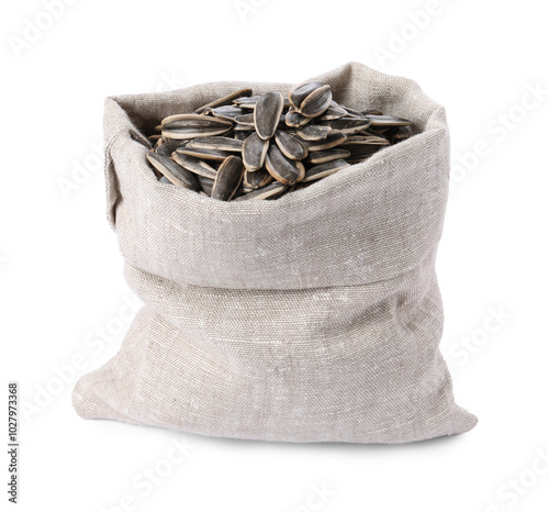 Sunflower seeds in burlap sack isolated on white