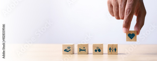 Health insurance concept. healthcare medical wooden cube block with icon, health and access to welfare health concept