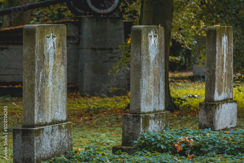 old soviet cemetery with a red star on the tombstone. cemetery of Russian soldiers fighting in World War II. abandoned cemetery, forgotten graves without names. military cemetery.