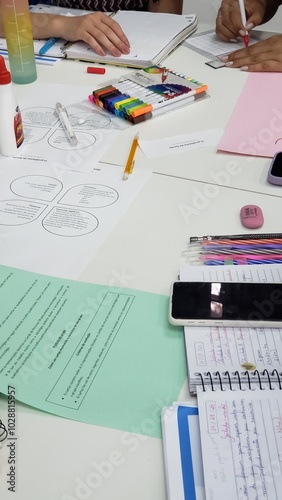 Various math activities on the table, some notebooks and markers