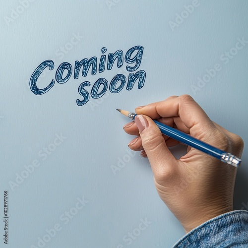 Handwriting text "Coming soon". concept meaning something is going to happen in really short time.