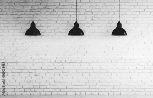 Three black industrial lamps on a white brick wall, minimalist style.