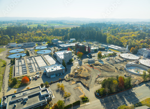 A large industrial area with a lot of buildings and trees