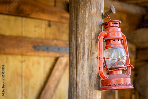 red oil lamp hanging in front of the entrance to the farm house. wild west