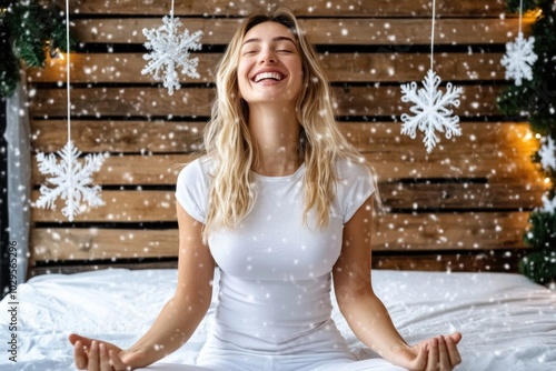 Joyful woman meditating in snowy winter wonderland indoors