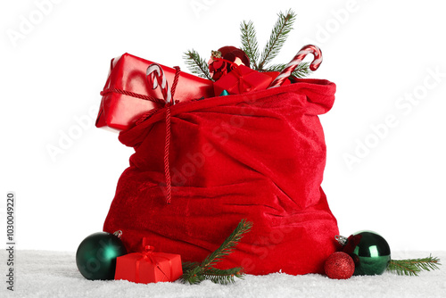 Santa bag with gift boxes, Christmas balls, candy canes and fir branches on white background