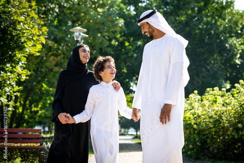 cinematic image of a family from the emirates spending time at the park